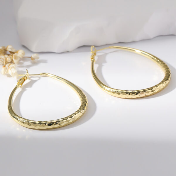 c0a655dc-e562-490d-aa17-be14d46f0f4c.jpg Golden Glossy Spring Fastener Egg-shaped Earrings Hypoallergenic Copper